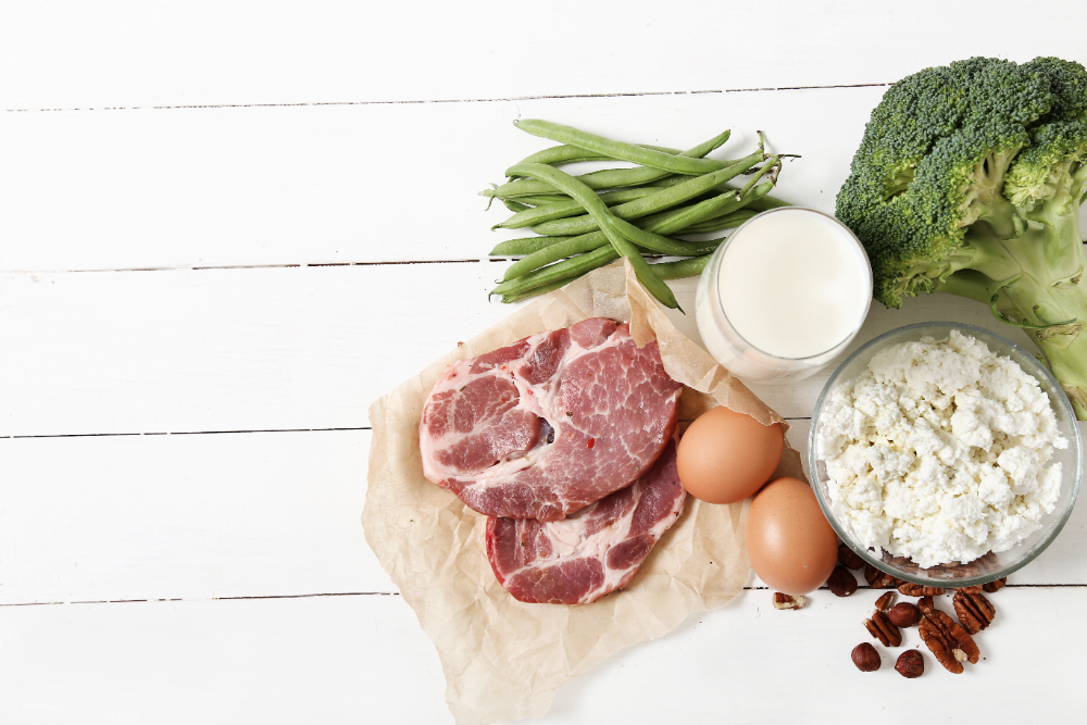 Healthy food rich in proteins on a white wooden table