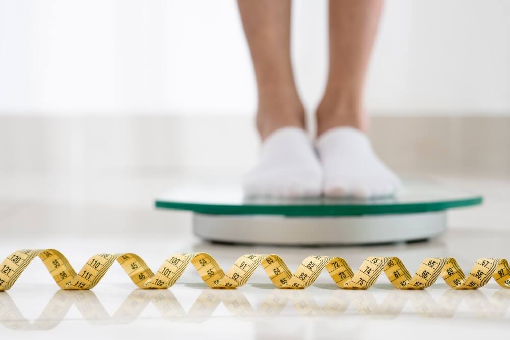 Person measuring on a scale