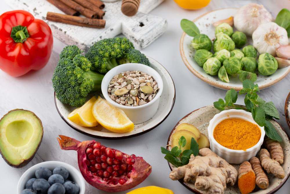Anti-inflammatory foods including broccoli, avocado, berries, ginger and turmeric